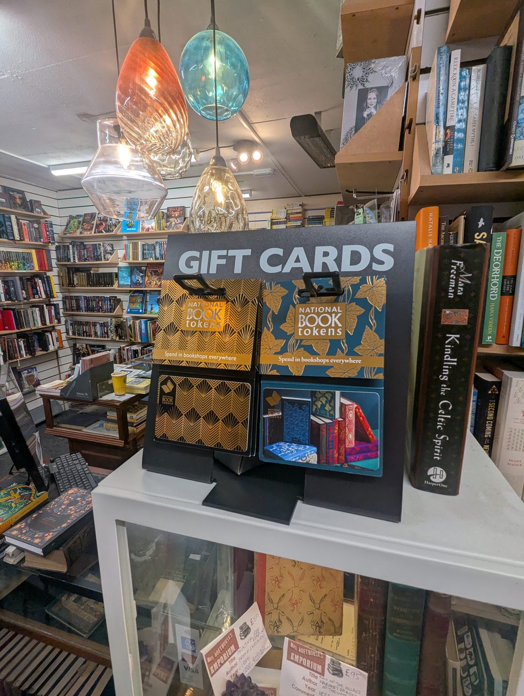 Gift cards and National Book Tokens on a glass display stand